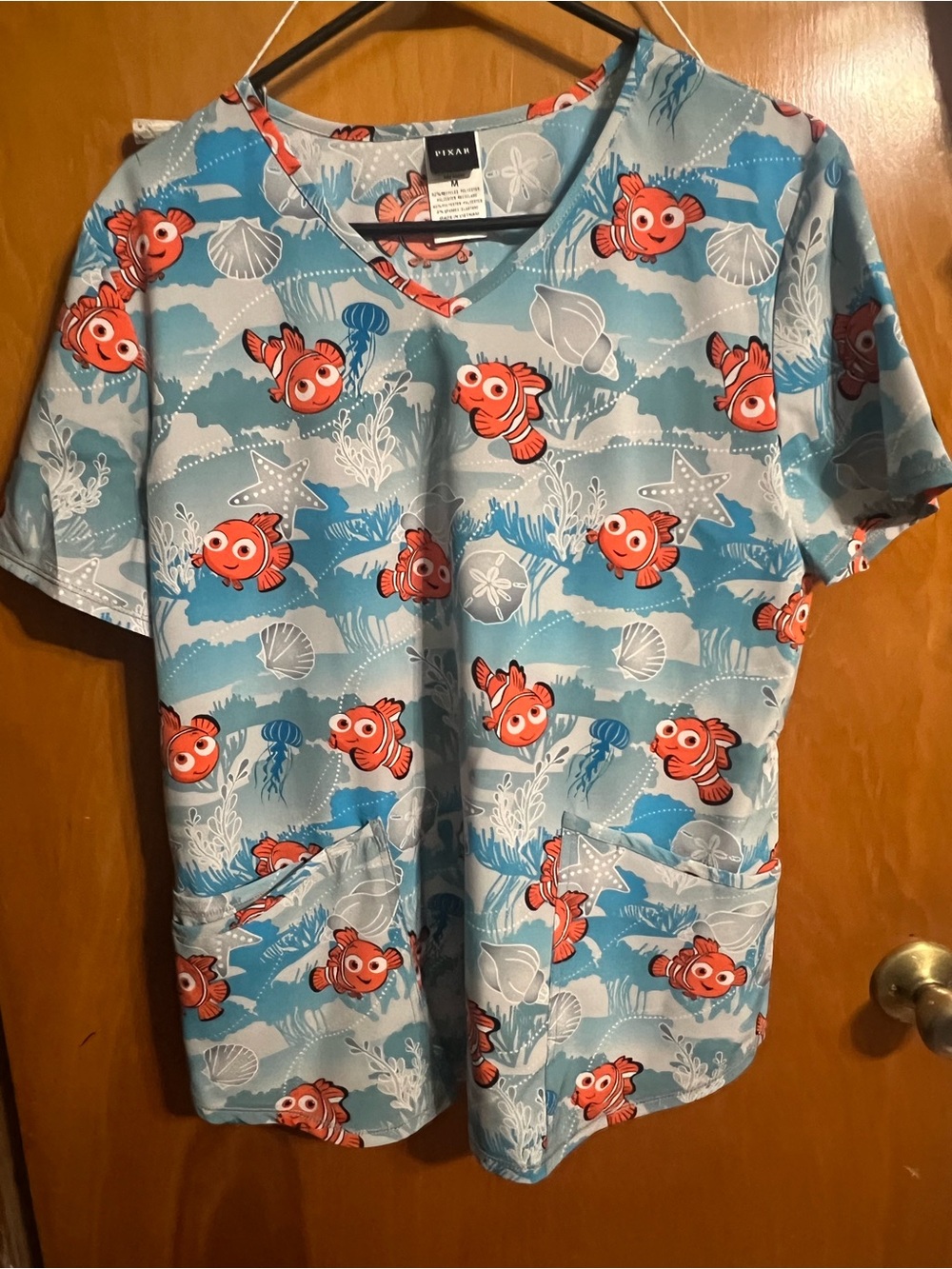 Pixar Finding Nemo Light Blue Scrub Top with Orange Fish Print